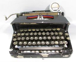 An early 20th century Corona typewriter in its original carry case.