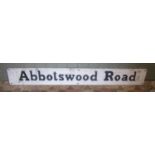 A vintage painted cast alloy sign with raised lettering Abbotswood Road, 18 cm high x 138 cm long
