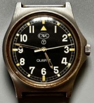 A CWC T Quartz wristwatch, black dial with white Arabic numerals with luminous compound, numbered