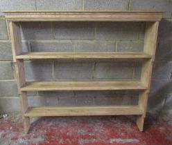 A stripped pine kitchen open plate rack with three fixed graduated shelves 128 cm high x 140 cm wide