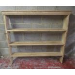 A stripped pine kitchen open plate rack with three fixed graduated shelves 128 cm high x 140 cm wide
