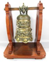 A Bronze Chinese Temple Dragon Gong hung from a wooden stand, 48cm x 40cm.