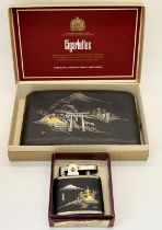 A Japanese cigarette case and matching cigarette lighter each with silver and gilt inlay depicting