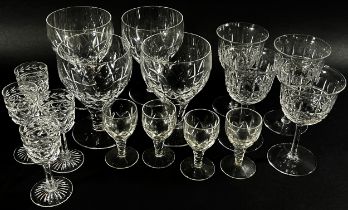 A suite of matching Georgian style star cut glasses including red and white wine glass, cordial,