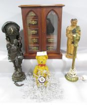A mixed lot to include wooden cabinet, teddy bear, wooden monk figure, contemporary clock, a spelter