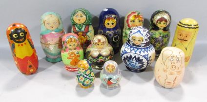 Ten Russian Matryoshka Dolls of varying heights, traditionally painted in bright colours and three