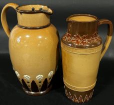 A Doulton Lambeth brown glazed jug with loop handle and applied geometric detail, with pewter lid