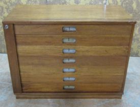 A teak plan chest of seven drawers - with central locking system, 98 cm wide x 49 cm deep x 75 cm