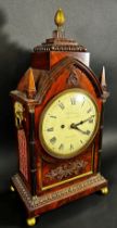 A Regency mahogany bracket clock, the case of Gothic design, enclosing a convex painted dial with