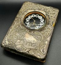 A late Victorian silver watch case with a country house scene and scrolled detail, Birmingham