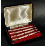 A cased set of four sterling silver propelling bridge pencils