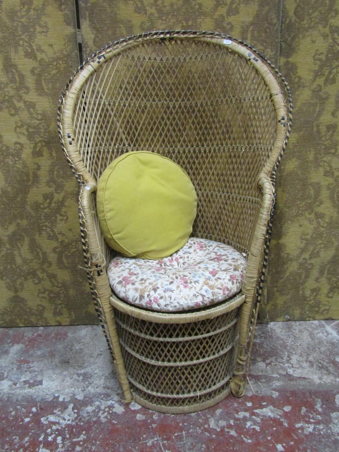 A woven wicker 'peacock' type chair