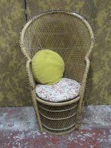 A woven wicker 'peacock' type chair