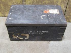 An Ex-military pine and steel banded travel trunk with stencil detail