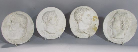 Four grand tour style oval plaster classical profile portraits of Roman dignitaries, after the