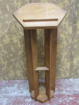 An unusual lectern in oak, the hexagonal top raised on six shaped supports