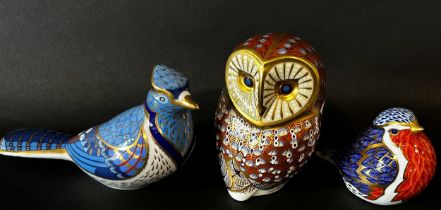 Six Royal Crown Derby porcelain animal paperweights / figures to include a walrus, penguin, owl,