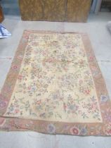 A 19th century Kashmiri hand stitched carpet with an all over floral pattern (as found with holes