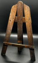 A miniature rosewood easel 'part of the propeller from aeroplane 888 sashed on active service Nov