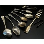 Assorted 19th century silver flatware, mostly spoons for various uses, a fork and two sugar tongs,