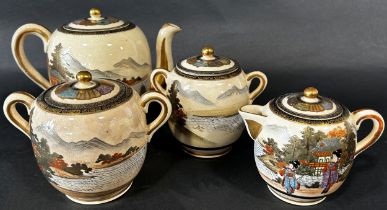 A collection of Japanese export Satsuma teawares comprising cups, saucers, teapot, sugar basin, etc