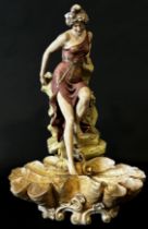 Royal Dux figure of a woman seated on a rock, 44cm high (af)