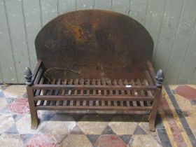 A cast iron fire basket of rectangular form, with arched back plate and pineapple finials, 68cm wide