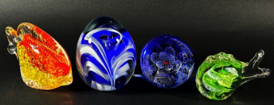 A collection of glass paperweights to include a Caithness ‘Fae Pink’ example with box, two exotic