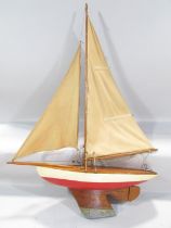 A vintage single mast pond yacht, with a lead re-enforced keel, 60cm long x 85cm high, and a