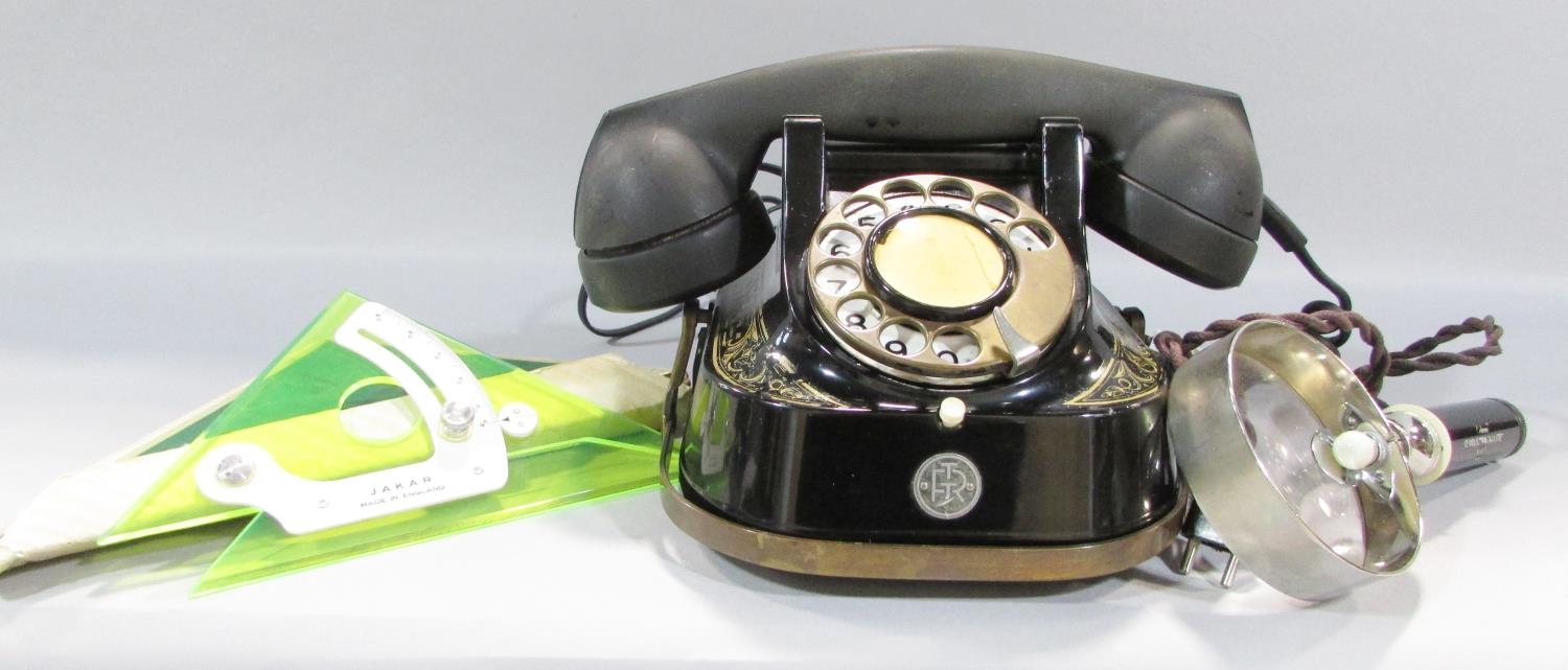 A Vintage Belgian telephone with conversion lead, an electronic illuminating magnifying glass and