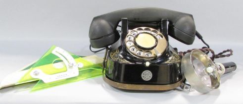 A Vintage Belgian telephone with conversion lead, an electronic illuminating magnifying glass and