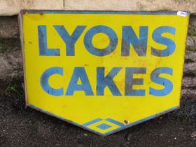A vintage wall mounted double sided enamel sign advertising Lyons cakes, the main plate 40 cm high x