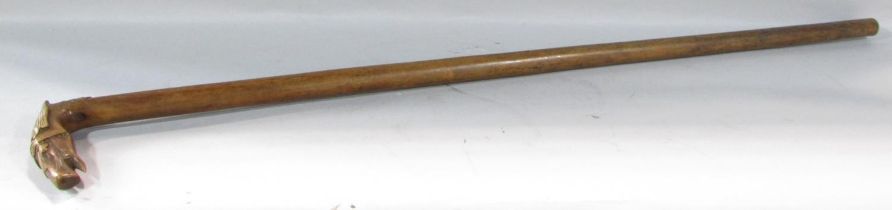 A walking stick with a carved head of a bridled horse handle, with an indistinct stamp, 83cm.