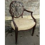 A late 19th century Hepplewhite style spider web elbow chair, the oval back supported by moulded and