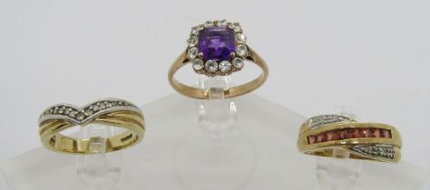 Three 9ct rings; a channel set garnet and diamond crossover example, a further diamond set