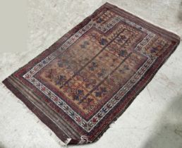 A Middle Eastern antique wool carpet with wear and tear throughout, , 240cm x 180cm, together with a