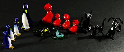A collection of hand made Venetian glass animals, including a Mounted Fox Hunting set with pack of