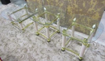 A set of three contemporary brass and timber occasional tables (a pair and one larger) all with oval
