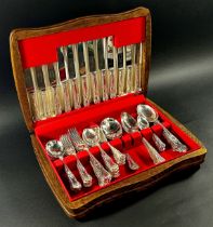 An oak canteen of silver plated shell pattern cutlery complete for six settings covering four