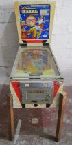 A vintage Champion pinball machine manufactured by Nordamatic, (af)