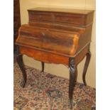 A 19th century French rosewood bone bonheur du jour, the serpentine fall front enclosing a maple-