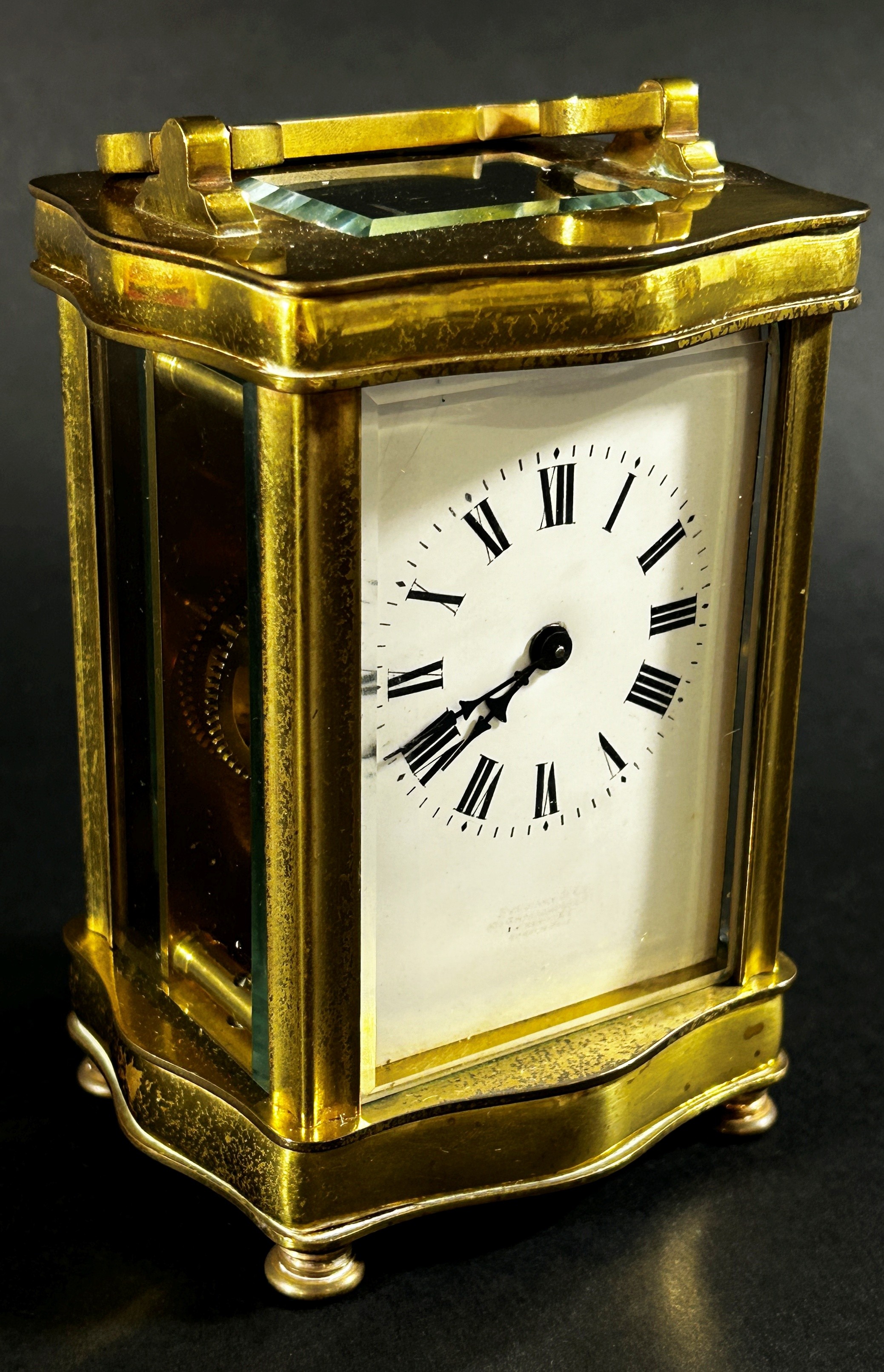 A brass carriage clock set within a shaped case with enamelled dial and eight day timepiece, - Image 4 of 5