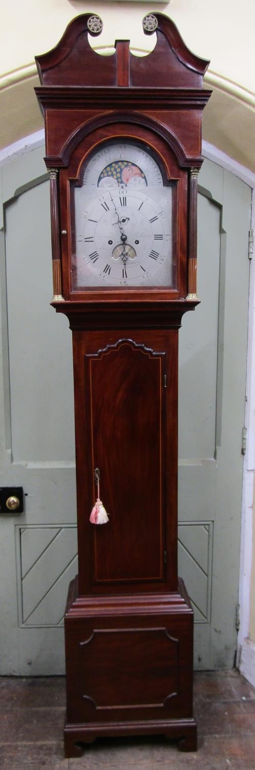 A Georgian mahogany longcase clock, the hood with swan neck pediment, the broken arch silvered