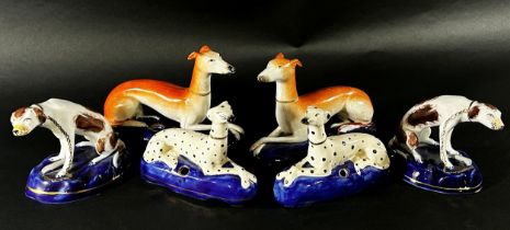 A collection of 19th century and later Staffordshire hounds, greyhounds, Dalmatians, etc, together