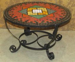A mid 20-th century occasional table with hand made mosaic top of geometric design raised on a