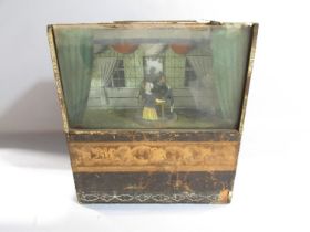 A 19th century ‘Box Theatre’ automaton of two couples dancing in a drawing room with a servant on