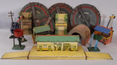 A collection of pre and post war Hornby 0 gauge buildings and lineside accessories including station