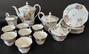 A Bavarian porcelain tea and coffee service of octagonal form, with floral painted detail,