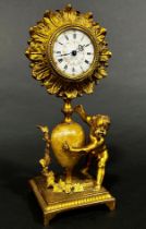 19th century gilt mantle clock the painted dial within a flower head border, surmounted on an onyx