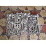 A weathered cast composition stone wall plaque depicting mediaeval characters (af)